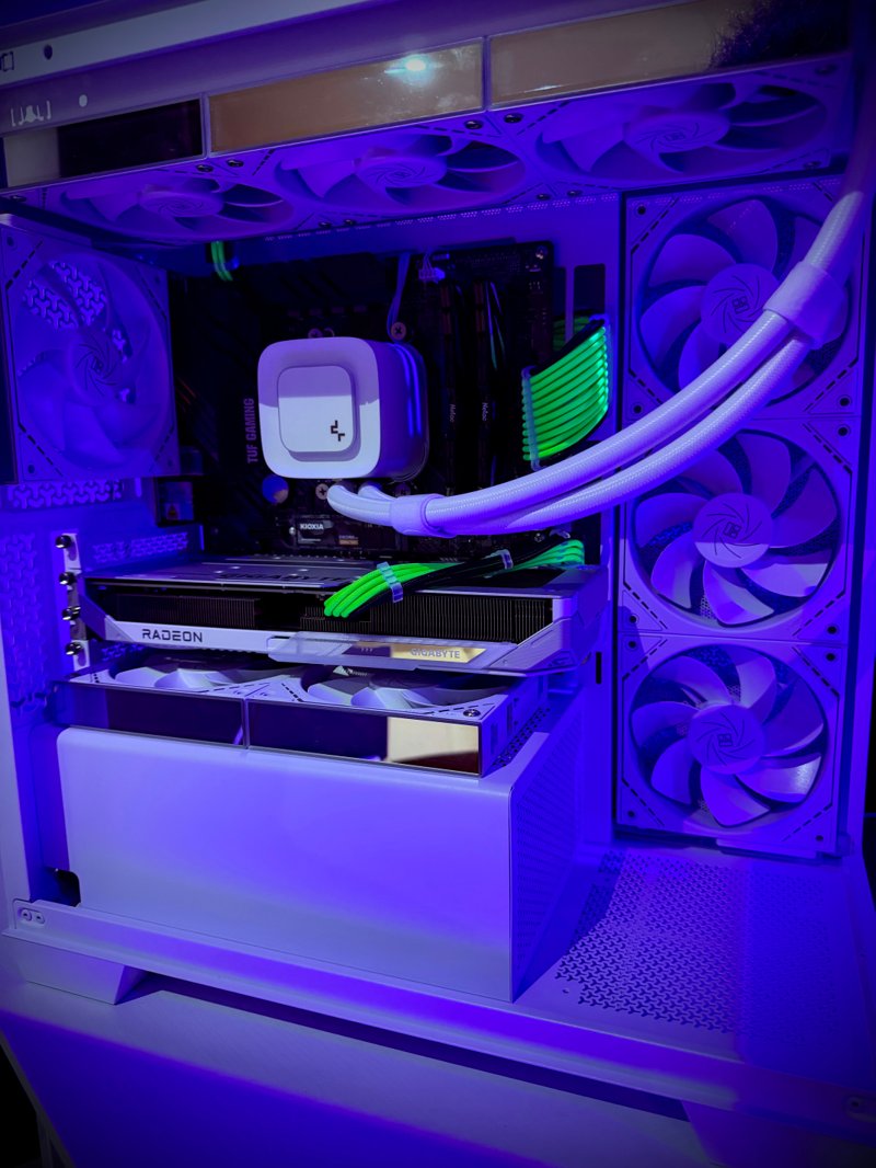 White gaming PC with violet lighting and a liquid cooler