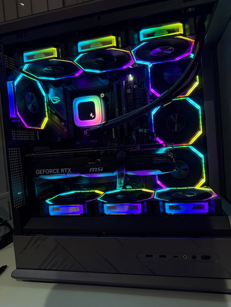 Black gaming PC with illuminated RGB fan rings and a GeForce RTX graphics card