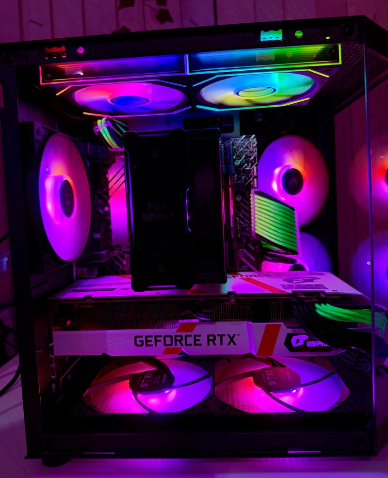 Gaming PC with magenta RGB fans and a GeForce RTX graphics card